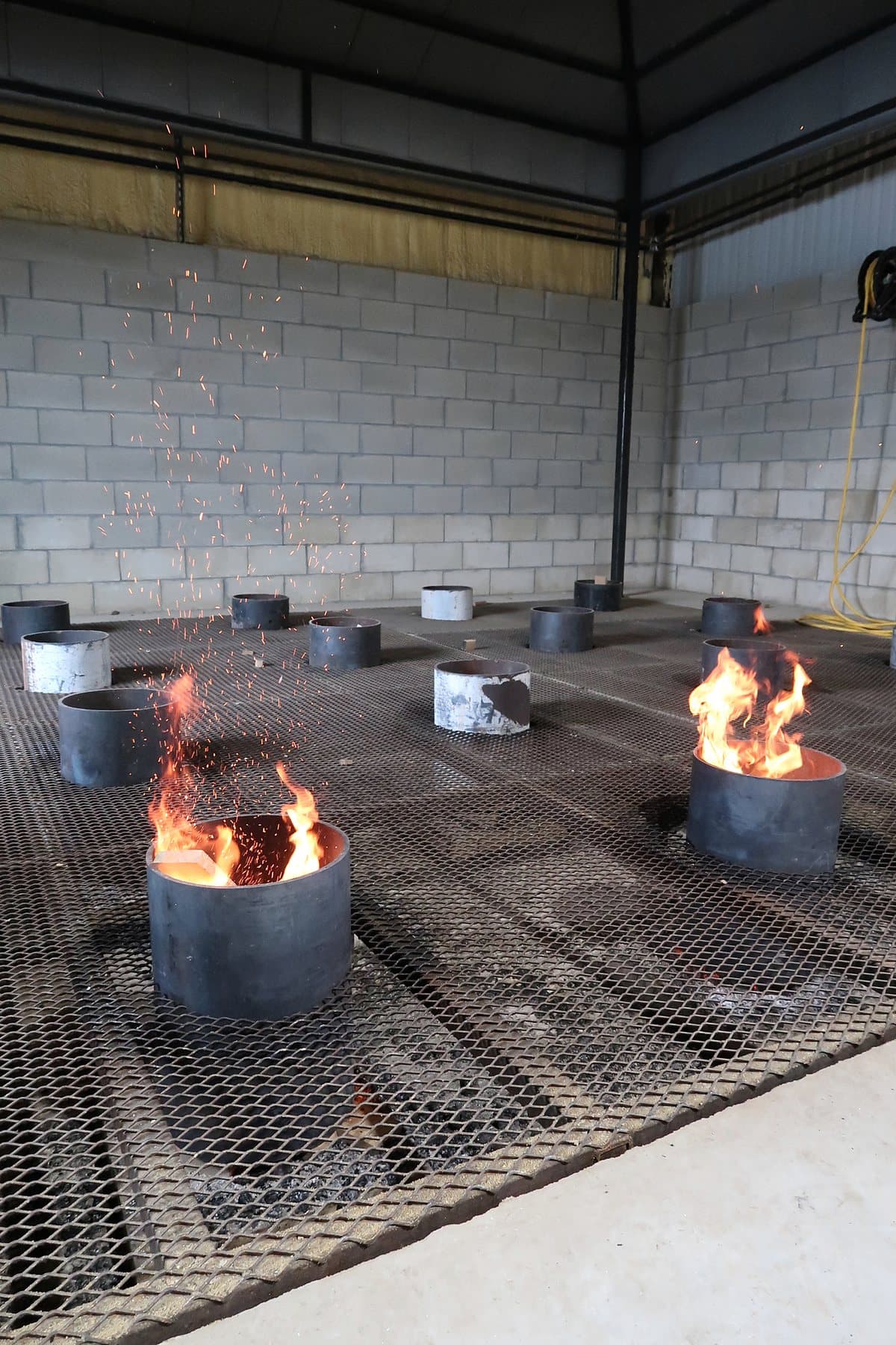Controlled wood fires and sparks in the Standard Cooperage fire room